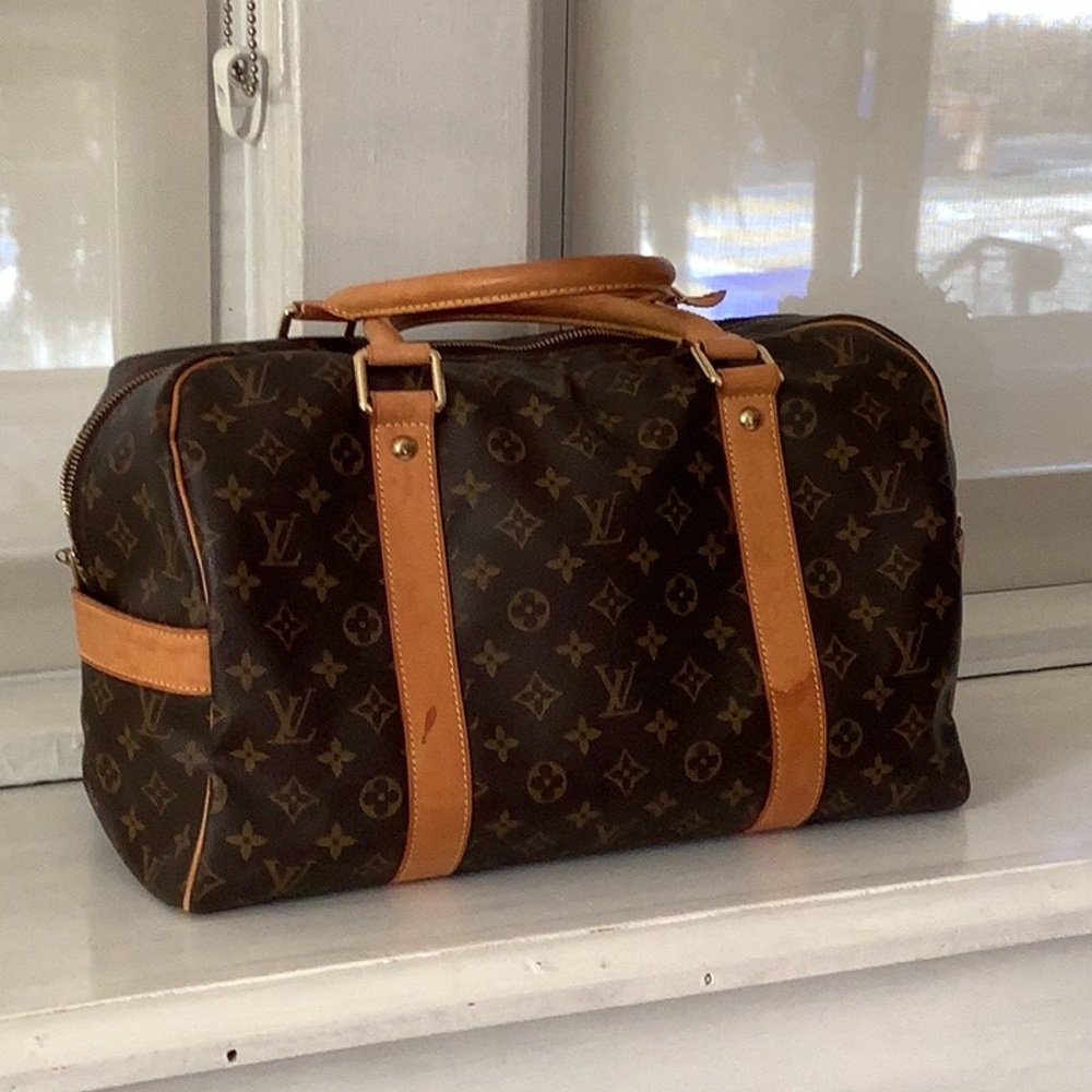 Louis Vuitton travel bag authentic guarantee